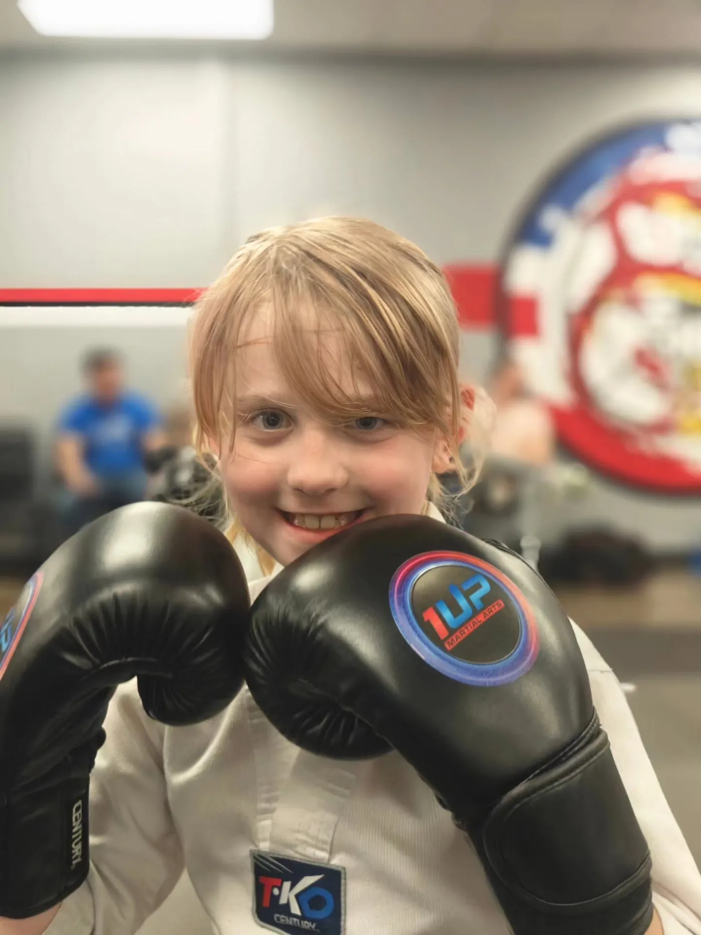 Smiling 1UP student in boxing gloves